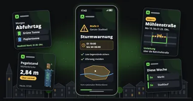 Ein Smartphone zeigt eine Sturmwarnung für den ganzen Landkreis mit Zeitfenster und Karte, umgeben von den Routinebeiträgen einer Stadt, einer Erinnerung an den Mülltag, einem Flusspegel, einer Straßensperrung und den Veranstaltungen der Woche, vor den Dächern einer Kleinstadt.